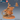 Digital render of an unpainted orange resin Giant Rat Pest Alchemist miniature by Epic Miniatures — a ratfolk alchemist in segmented armour riding a large armoured giant rat, holding a flaming torch aloft, with a coiled rope harness and satchel on the mount, crouched on a cracked stone base. A thumbnail rear-angle view and a blue d20 are visible in the upper right corner.