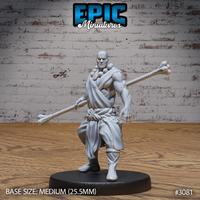 Muscular bald monk in a dynamic low stance, holding a long bone staff diagonally across his body, wearing a draped wrap and medallion-decorated cord belt. Sculpt by Epic Miniatures.