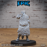 Scale-hide cloak covering the back of a broad-shouldered barbarian, individual overlapping scales covering the full torso and arms, a spiked weapon raised over the shoulder, with clawed boots visible at the base. Sculpt by Epic Miniatures.