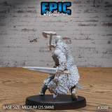 Barbarian sculpt seen from behind, axe raised above the head in a two-handed grip, draped in a sweeping cloak of overlapping scales with a broad decorative belt across the lower back, short sword extended at the side. Sculpt by Epic Miniatures.
