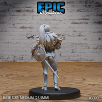 Female elf fighter shown from behind, long ponytail flowing down her back, large round knotwork shield strapped across her shoulders, longsword hanging at her side. Detailed studded leg armour and layered fur collar visible. Sculpt by Epic Miniatures.