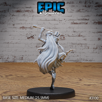 Female elf ranger seen from behind, long flowing hair cascading down her back, arm raised holding an arrow, quiver visible over her shoulder, coat flaring outward mid-motion. Sculpt by Epic Miniatures.