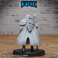 Rear of a dwarf cleric showing a large round-bossed shield strapped to his back, a flowing chainmail-textured cape, and articulated pauldrons with riveted detail. Epic Miniatures sculpt.
