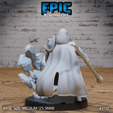 Rear view of a dwarf cleric miniature showing finely textured chainmail covering the back and shoulders, with rocky debris spread across the base. Sculpt by Epic Miniatures.