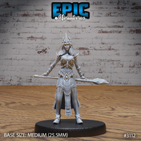 Female wizard standing upright in ornate plate armour with diamond detailing, holding a long crystal-tipped staff at her side, wearing a spiked crown helm and long loose hair. Sculpt by Epic Miniatures.