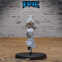 Female wizard seen from behind, spiked crown visible above long flowing hair, ornate spike-knuckled gauntlets raised at her sides, layered robes sweeping mid-stride. Sculpt by Epic Miniatures.