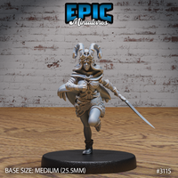Female druid sprinting forward, one knee raised, wearing a horned skull-topped helmet with a crescent clasp cape. Long rapier held low in trailing hand. Feathered skirt and layered cloak. Epic Miniatures sculpt #3115.