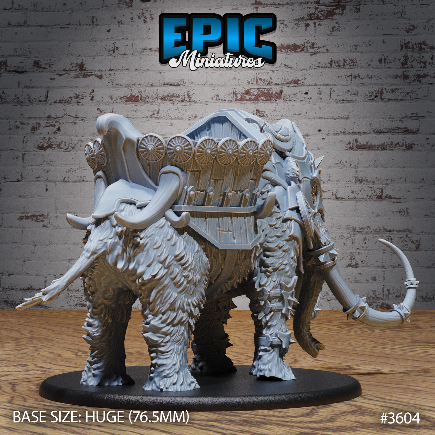 Unpainted grey resin war mammoth miniature on a 76.5mm Huge base, shown from the rear-right angle. The back of the howdah is visible, featuring a row of spoked shields along its sides and a rack of javelins or bolts. Spiked leg guards, layered leather straps, and dense fur texture are clearly visible across the mammoth's haunches and flanks.