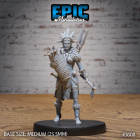 Front view of an unpainted grey resin 32mm miniature of a tribal female fisher — she wears a large feathered and horned headdress, a feathered cape, and carries a woven basket on her back, a bone-topped skull staff in one hand, and has a broad axe at her side. Printed on a medium round base.