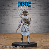 Rear view of the same unpainted grey resin tribal female fisher miniature, showing the woven basket packed with catch, a long serrated spear rising above it, her feathered cape and hide skirt, and clawed feet. Medium round base, 25.5mm.