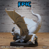 Unpainted grey resin White Dragon Wyrmling miniature by Epic Miniatures, rear-three-quarter view showing the ribbed wing membranes, spiked ridged tail curling upward, muscular haunches, and detailed back scaling, on a medium 25.5mm black base