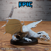 Unpainted grey resin white dragon wyrmling miniature by Epic Miniatures, photographed from the front-right — clearly showing the domed skull, bulging reptilian eye, spiked head detail, individual body scales, and outstretched wings on a medium 25.5mm round base