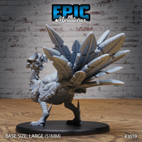 Unpainted grey resin Turkey Raptor miniature from Epic Miniatures, rear three-quarter view — showing the full layered feather fan spread wide, overlapping scaled body texture, reverse heel spurs on taloned feet, and 51mm large round base