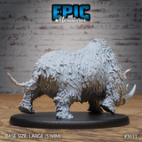 Unpainted grey resin woolly rhinoceros miniature, side profile view, showing full body shaggy coat detail, muscular hump, and second curved horn visible on a 51mm large oval black base