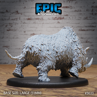 Unpainted grey resin woolly rhinoceros miniature, side profile view, showing full body shaggy coat detail, muscular hump, and second curved horn visible on a 51mm large oval black base