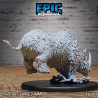 Unpainted grey resin woolly rhino miniature by Epic Miniatures, photographed from the rear-right — shaggy fur texture visible across haunches and back, charging pose with weight forward, ice scatter base detail, mounted on a large 51mm oval black base