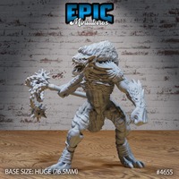 Front-facing render of Yeenoghu Demon Lord miniature by Epic Miniatures — a huge gnoll-like demon with scaled mane, fanged open mouth, and a double-headed spiked flail raised mid-swing in one hand, clawed free hand extended, on a 76.5mm base