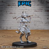 Unpainted grey resin Female Jackalwere miniature — front view — jackal-headed female warrior in layered segmented armour with scaled bracers, curved blade raised over shoulder, one leg raised mid-pivot, clawed feet, braided hair, on a 25.5mm round base