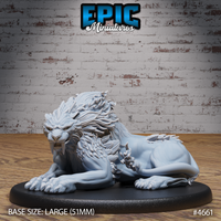 Front three-quarter view of an unpainted grey resin sabertooth beast miniature by Epic Miniatures, shown in a resting pose with forelimbs extended, head raised and teeth bared in a snarl, with a dramatic layered feathered mane and broad clawed paws, mounted on a large 51mm oval black base