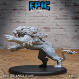 Front-left view of an unpainted grey resin sabertooth beast miniature on a 51mm black base — the large creature rears up on its hind legs with one clawed forepaw raised, feathered mane bristling, jaws open wide to reveal elongated saber-teeth, and a barbed tail curved behind it