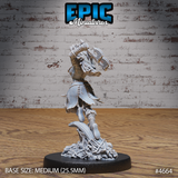 Rear view of the same unpainted orc barbarian miniature, showing the corset-laced leather back, bone-wrapped legs, and skull-and-bone-scattered scenic base with a curved blade element at the foot