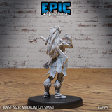 Rear view of the same unpainted grey resin orc female miniature — long flowing braids threaded with cord and bone charms, ragged-hemmed coat, heavily detailed tribal wraps, large axe visible across the back, fur-trimmed boot wrappings