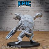 Unpainted grey resin Hook Horror miniature on a large 51mm black base, rear three-quarter view — showing the creature's large domed segmented carapace shell in full detail, hooked claws visible on either side, clawed bird-like feet gripping the base, photographed against a white brick wall background