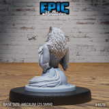 Rear view of the same unpainted grey resin female werewolf miniature — showing the full sweep of her layered fur mane down her back, a coiling tail, and flowing lower form, mounted on a medium 25.5mm base