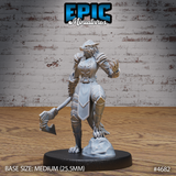 Three-quarter front view of the unpainted grey resin armoured female werewolf miniature by Epic Miniatures, highlighting the snarling wolf head with swept-back ears, layered brow detail, raised clawed gauntlet, and chevron-detailed leg armour on a rocky scenic base