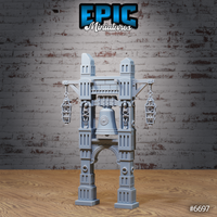 Unpainted grey resin bell ruins terrain piece showing the ornate central bell, two skeleton figures locked into the main pillar alcoves, and two caged skeleton lanterns suspended from crossbeams — slightly elevated front view