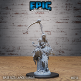 Front view of an unpainted grey resin Wraith Mother miniature by Epic Miniatures — a female undead figure rising from a skull-strewn base, holding a spine-forged scythe aloft in one hand and a skull against her torso with the other, her tattered robes billowing dramatically around her on a large 51mm base