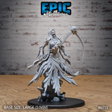 Front view of unpainted grey resin Wraith Mother Fly miniature by Epic Miniatures — a mummified undead female figure in tattered robes, wielding a skull-topped bone scythe, mouth open in a silent scream, mounted on a large 51mm scenic rubble base