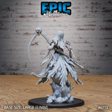 Rear view of unpainted grey resin Wraith Mother Fly miniature by Epic Miniatures — showing long flowing tattered robes with jagged torn hem, spine-ribbed scythe shaft, and detailed 51mm scenic stone base