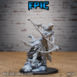 Front view of an unpainted grey resin Wraith Mother miniature — a skeletal undead figure in tattered robes, raising a gnarled staff aloft in one hand and wielding a long skull-tipped scythe in the other, mounted on a large 51mm rocky base