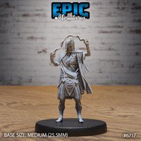 Front view of an unpainted grey resin 32mm miniature of a novice lich — a gaunt undead spellcaster in tattered robes, arms raised with magical energy tendrils coiling from both hands, adorned with layered necklaces and geometric arcane beltwork, mounted on a medium 25.5mm black base