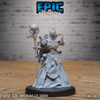 Front view of an unpainted grey resin Experienced Lich miniature by Epic Miniatures — skeletal figure in ornate armour and layered robes, wearing a tall horned crown, holding a skull-orb staff in one hand and raising the other in a spellcasting gesture, on a medium 25.5mm black round base