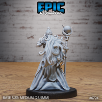 Rear view of the unpainted grey resin Experienced Lich miniature by Epic Miniatures — showing flowing ethereal tendrils cascading from beneath the horned crown down the back of the robes, with the skull-orb staff visible to the right, on a medium 25.5mm black round base