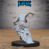 Unpainted grey resin Ghoul Gravecaller miniature by Epic Miniatures, shown from the rear — dramatic sweeping robes billowing behind the figure, knotted bone fetishes hanging from the belt clearly visible, one arm raised with clawed hand extended, showing the full flow and movement of the dynamic lunge pose on a medium 25.5mm round base