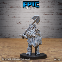 Rear view of the unpainted grey resin Turtlefolk Grave Robber miniature by Epic Miniatures — showing a large natural shell on the back encrusted with jagged rock-like protrusions, with detailed rope bindings on the shins and the axe resting across the shoulder