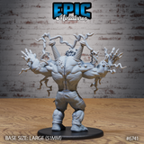 Rear view of the Electric Frankenstein unpainted grey resin miniature on a 51mm black round base — showing the creature's broad muscular back, two prominent mechanical coil devices mounted on the spine, and four symmetrical lightning bolt arcs spreading outward from the arms, photographed against a brick wall background