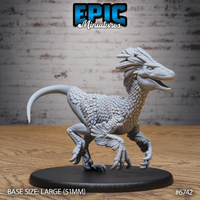 Unpainted grey resin feathered raptor miniature on a 51mm large black base, shown from a front-angled view — mid-stride pose with open jaws, spread claws, feathered crest atop the skull, and layered plumage across chest and arms. Epic Miniatures sculpt #6742.
