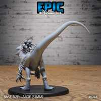 Unpainted grey resin raptor miniature by Epic Miniatures — rear three-quarter view showing the long arching tail, smooth flanks, feathered crest and frill at the back of the head, and powerful hindleg talons, on a large 51mm round black base