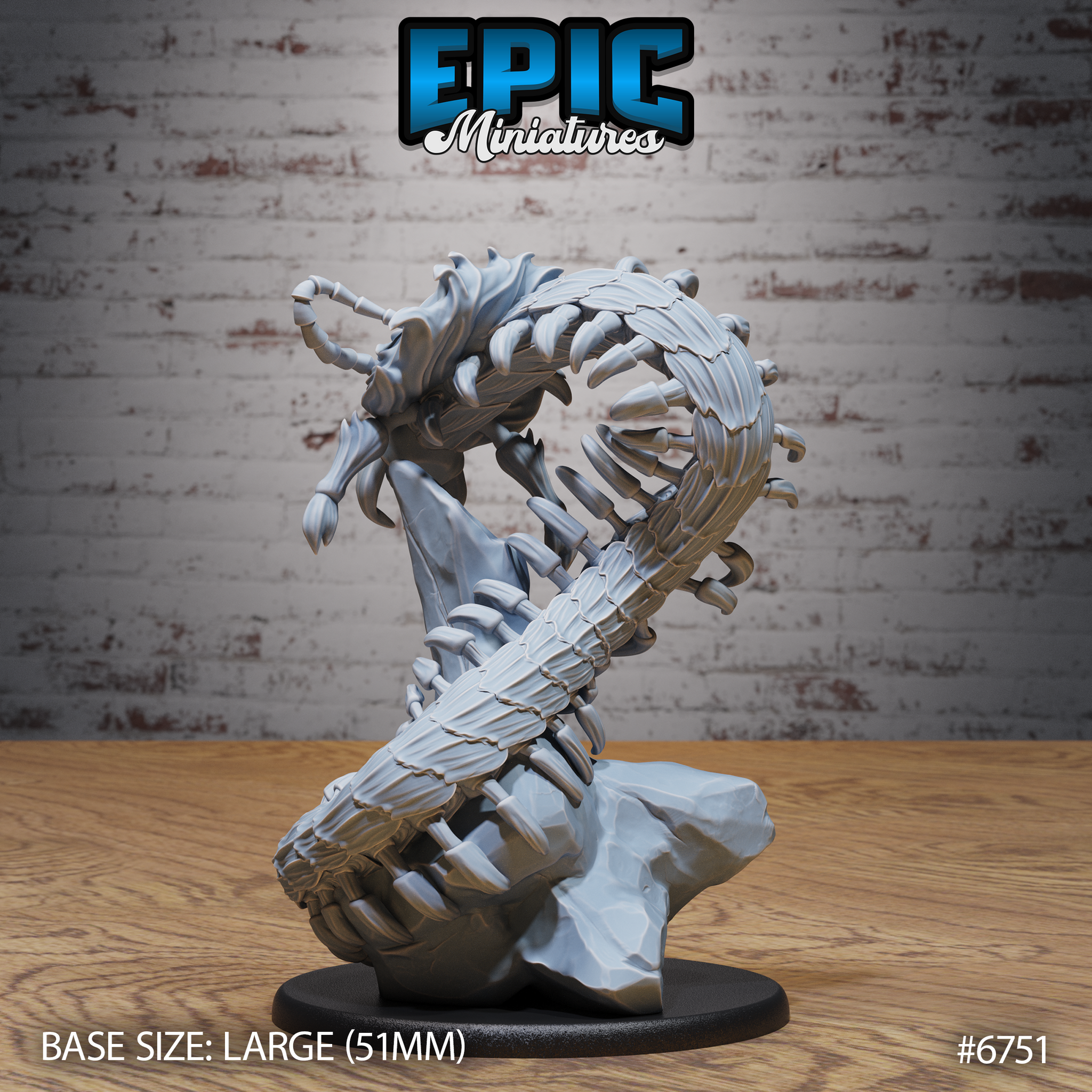 Unpainted grey resin Primal Centipede Stand miniature by Epic Miniatures — rear three-quarter view showing the full segmented underside of the coiling body, detailed chitin plating and leg arrangement visible, mounted on a rocky terrain base with a large 51mm black base