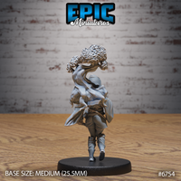 Rear view of the Amazoness Druid miniature by Epic Miniatures — unpainted grey resin showing the back of the hooded druid figure and the full twisted trunk of the tree spirit rising behind her, with detailed bark texture and a single flowering canopy visible above. Medium 25.5mm base.