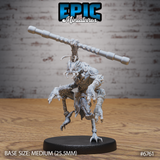 Front view of an unpainted grey resin Insectoid Monk miniature by Epic Miniatures — a chitinous insectoid humanoid in a dynamic one-legged martial arts stance, holding a long segmented staff horizontally at shoulder height, with tattered cloth draping from the waist and curved antennae rising from the skull, on a medium 25.5mm round black base