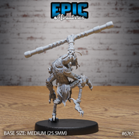 Rear view of an unpainted grey resin Insectoid Monk miniature by Epic Miniatures — showing broad textured chitin-armoured shoulders, a fanged mandible jaw visible over the creature's shoulder, articulated clawed limbs, and a long segmented staff raised aloft, on a medium 25.5mm round black base