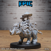 Front view of an unpainted grey resin Mushroom Boar miniature on a dark round base — a tusked boar covered in layered leaves, vines, and clusters of mushrooms rising to a tall flat-capped fungus crown, viewed from the front-left at table level