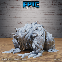 Unpainted grey resin Shambling Mound crawling miniature from Epic Miniatures, viewed from front-left. The large creature crouches low on four splayed claw-tipped root limbs, its body a dense mass of twisted bark strips and leaf fragments. Shackle-like bands circle each limb. Base size large 51mm. Product number 6776.