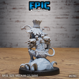 Rear view of the same unpainted grey resin Jungle Goblin miniature showing mushrooms growing along the goblin's shoulders and spine, rope-bound armour panels, a curling tail, and the detailed root mound base with curved tendrils. Medium 25.5mm base. Epic Miniatures catalogue number 6780.