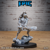 Front view of the Frog Folk Hunter alternative head variant — same mid-strike pose and serrated bone club but with a dramatic swept-back quill mane framing the amphibian face, unpainted grey resin, 32mm scale by Epic Miniatures